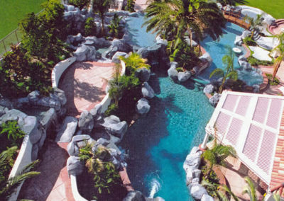 Luxurious pool with a glass-like surface reflecting the sky.