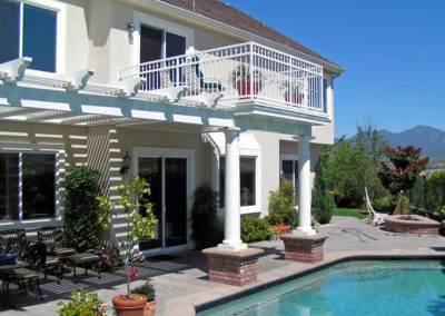 Resort-style pool design with vibrant blue water.