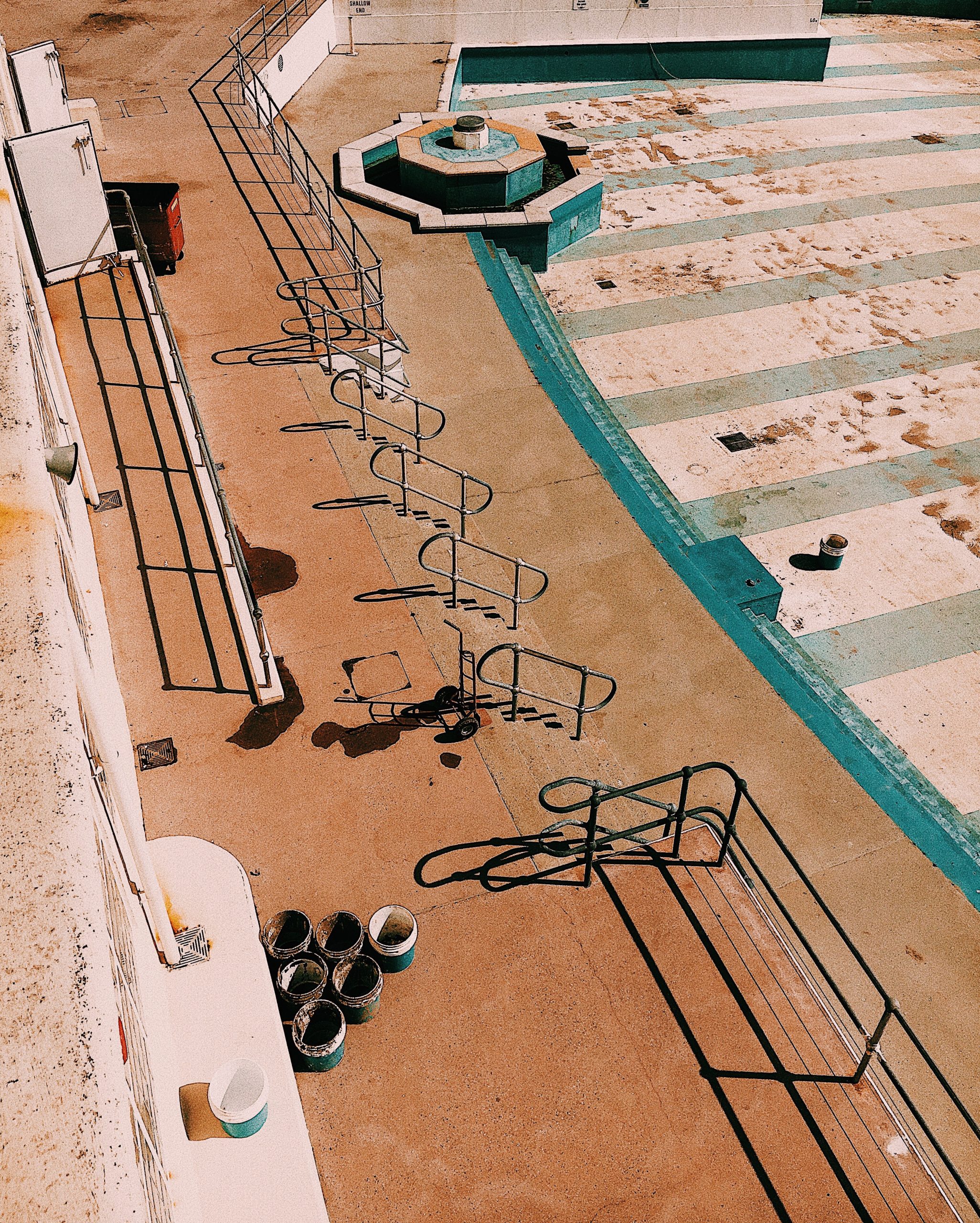 Woman enjoying a poolside view at a resort.